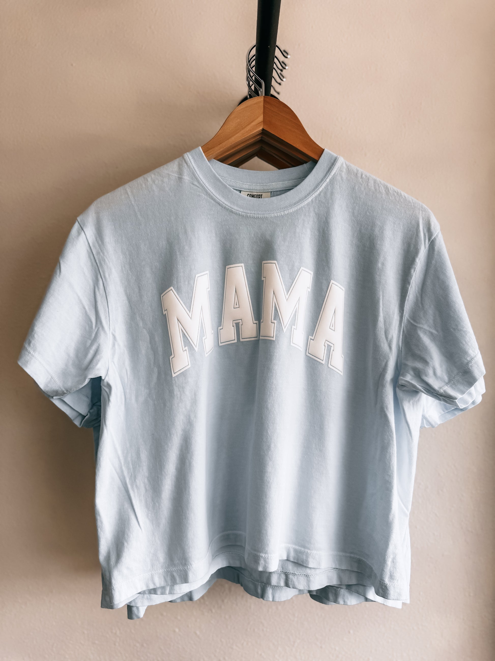 A sky blue crop top with the text 'MAMA' printed in white letters - Birkland Boutique Deer Park WA