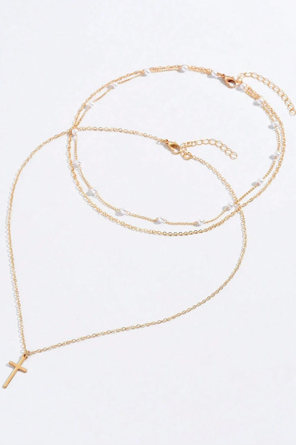 Gold layered cross necklace with delicate beaded chain Christian jewelry from Birkland Boutique faith-based boutique.