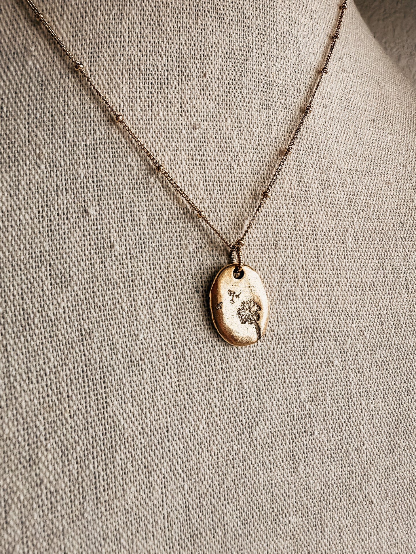 Hand stamped dandelion puff necklace gold tone - Birkland Boutique