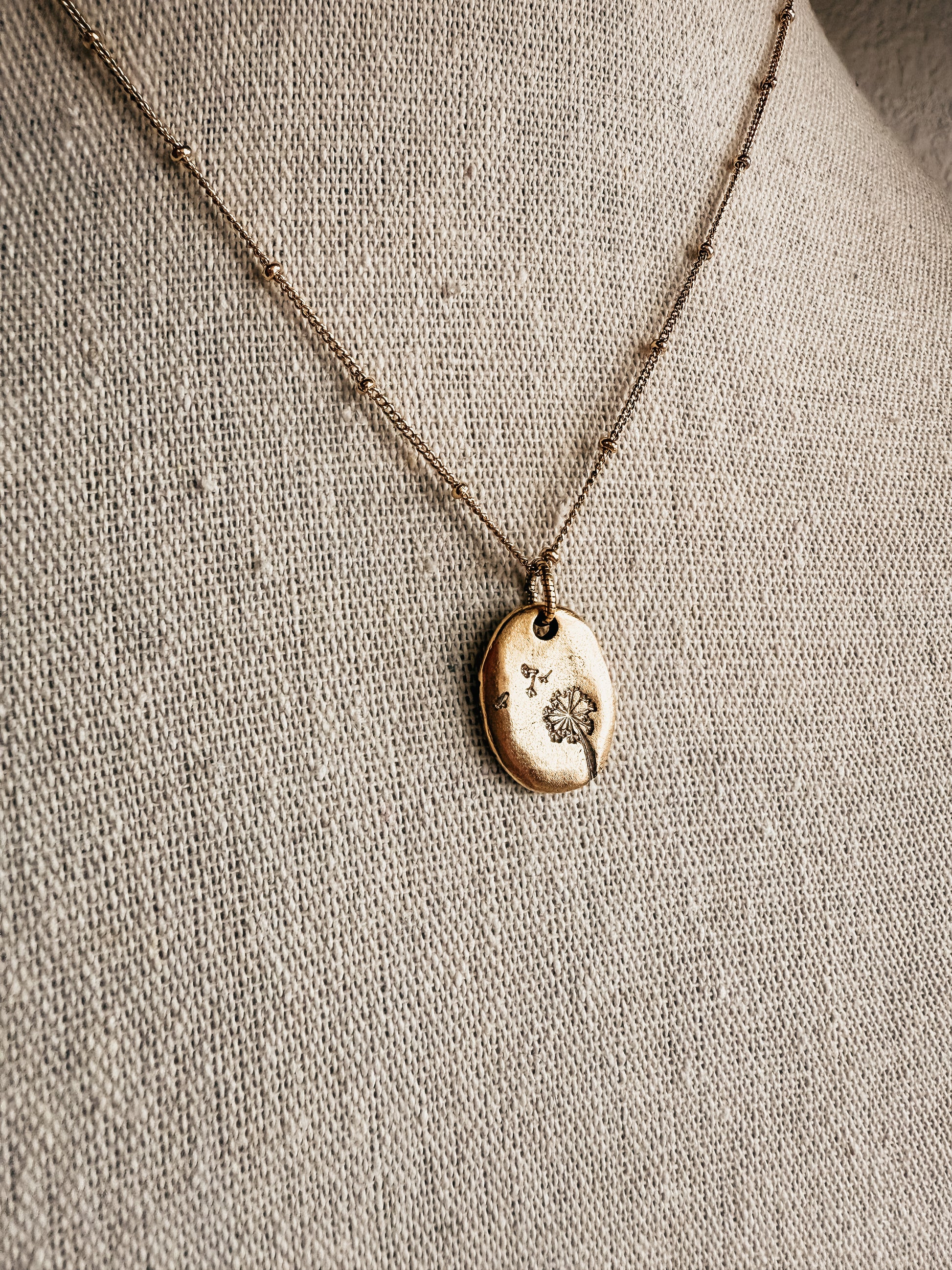 Hand stamped dandelion puff necklace gold tone - Birkland Boutique