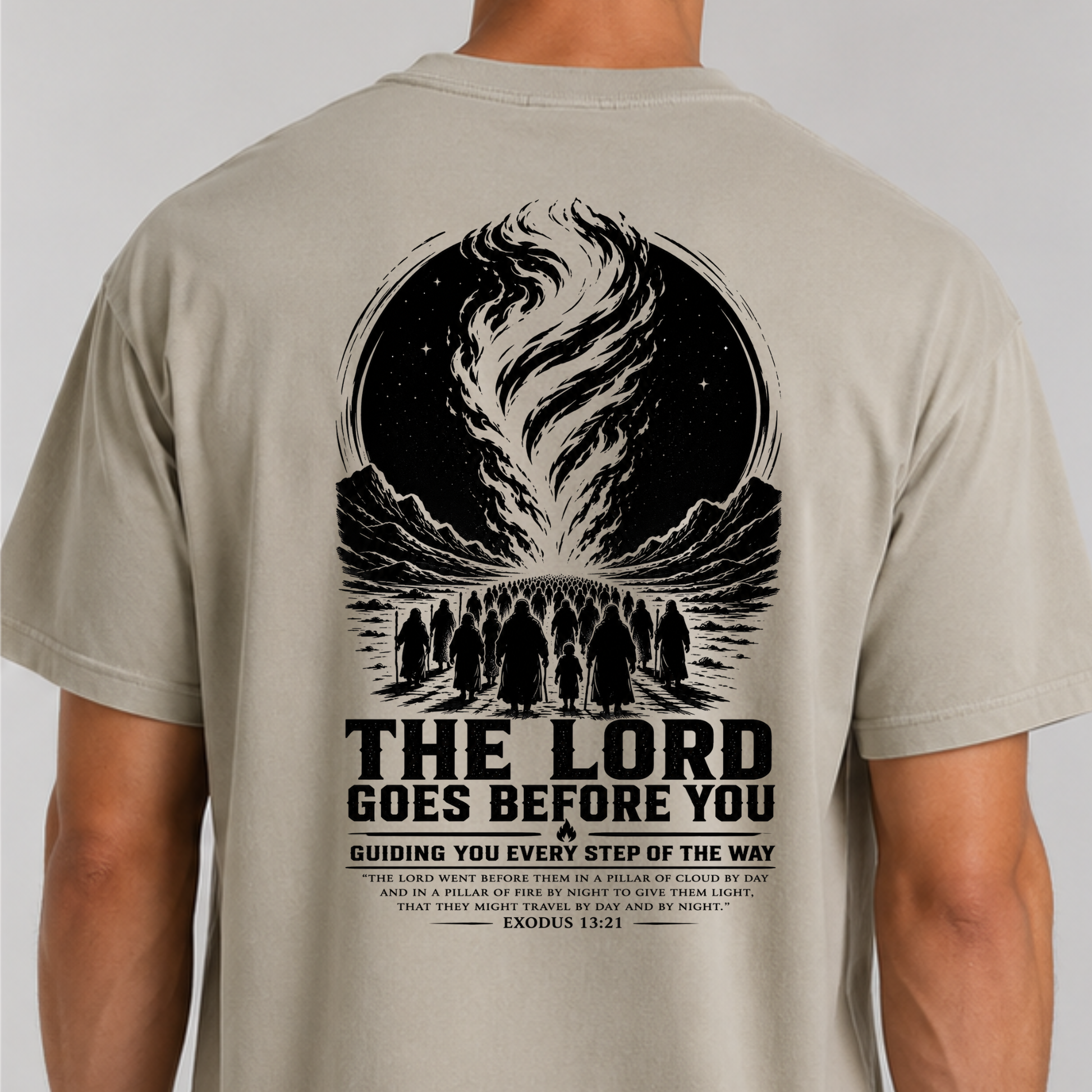 Back of Christian graphic tee with pillar of cloud and fire artwork and Exodus 13:21 Bible verse reminding believers that the Lord goes before them.