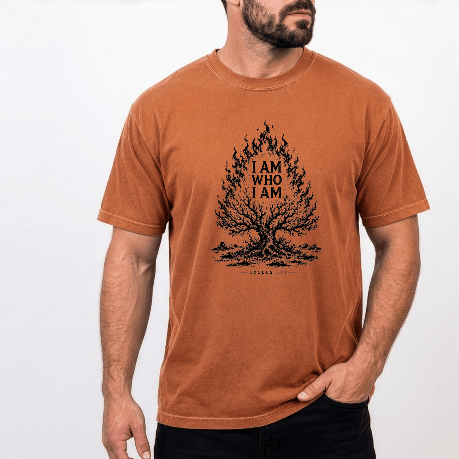 Man wearing the I AM WHO I AM Christian graphic tee featuring the burning bush and Exodus 3:14 Scripture on a vintage rust-colored unisex shirt.