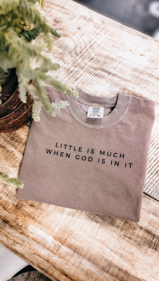 Women's Christian T-shirt with the message 'Little is Much When God Is In It' in a stylish design